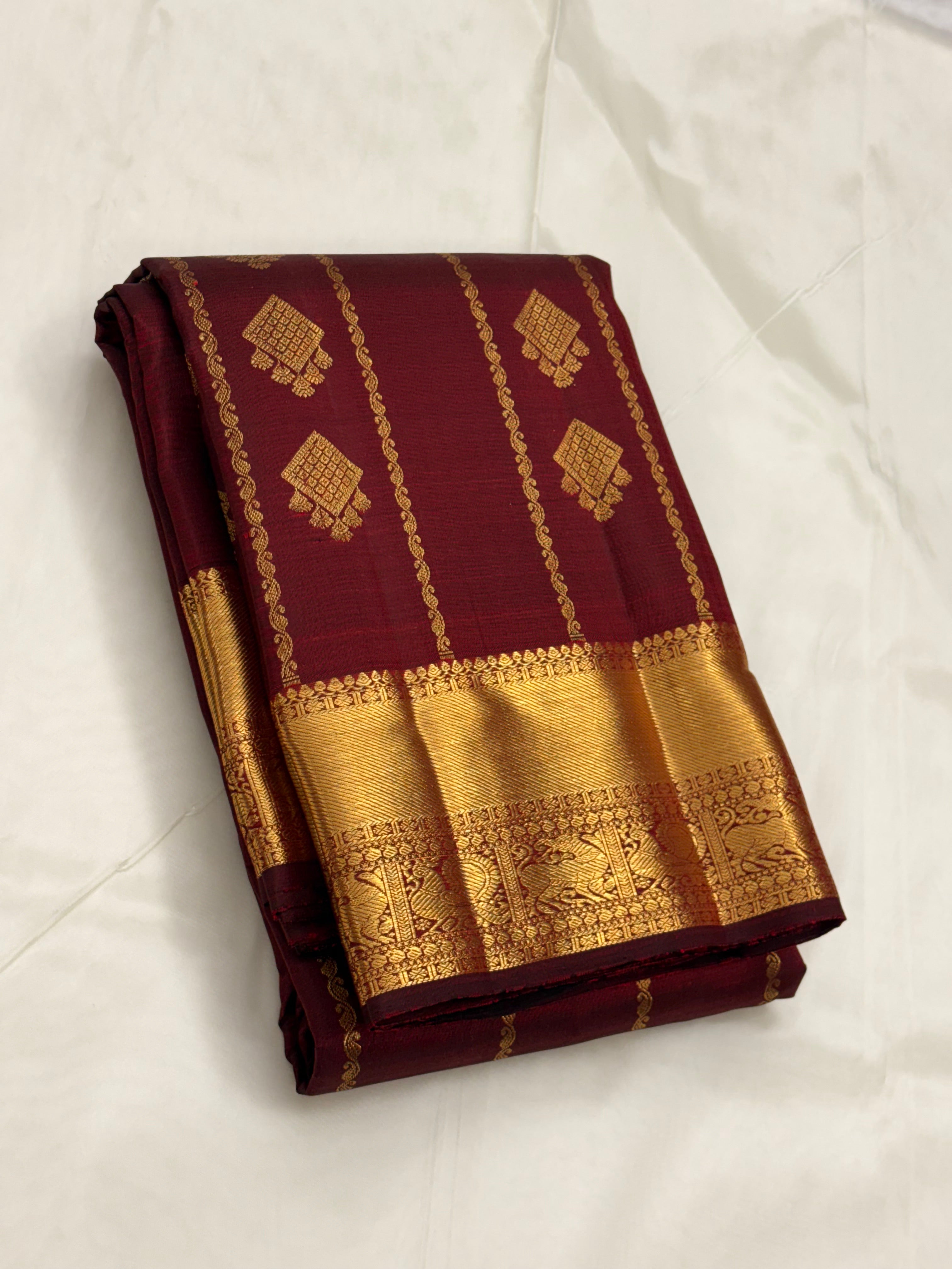 Maroon kanchipuram silk saree with veldhari weaving
