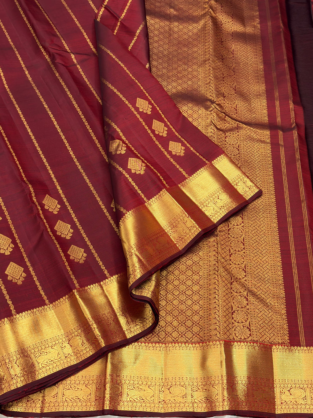 Maroon kanchipuram silk saree with veldhari weaving
