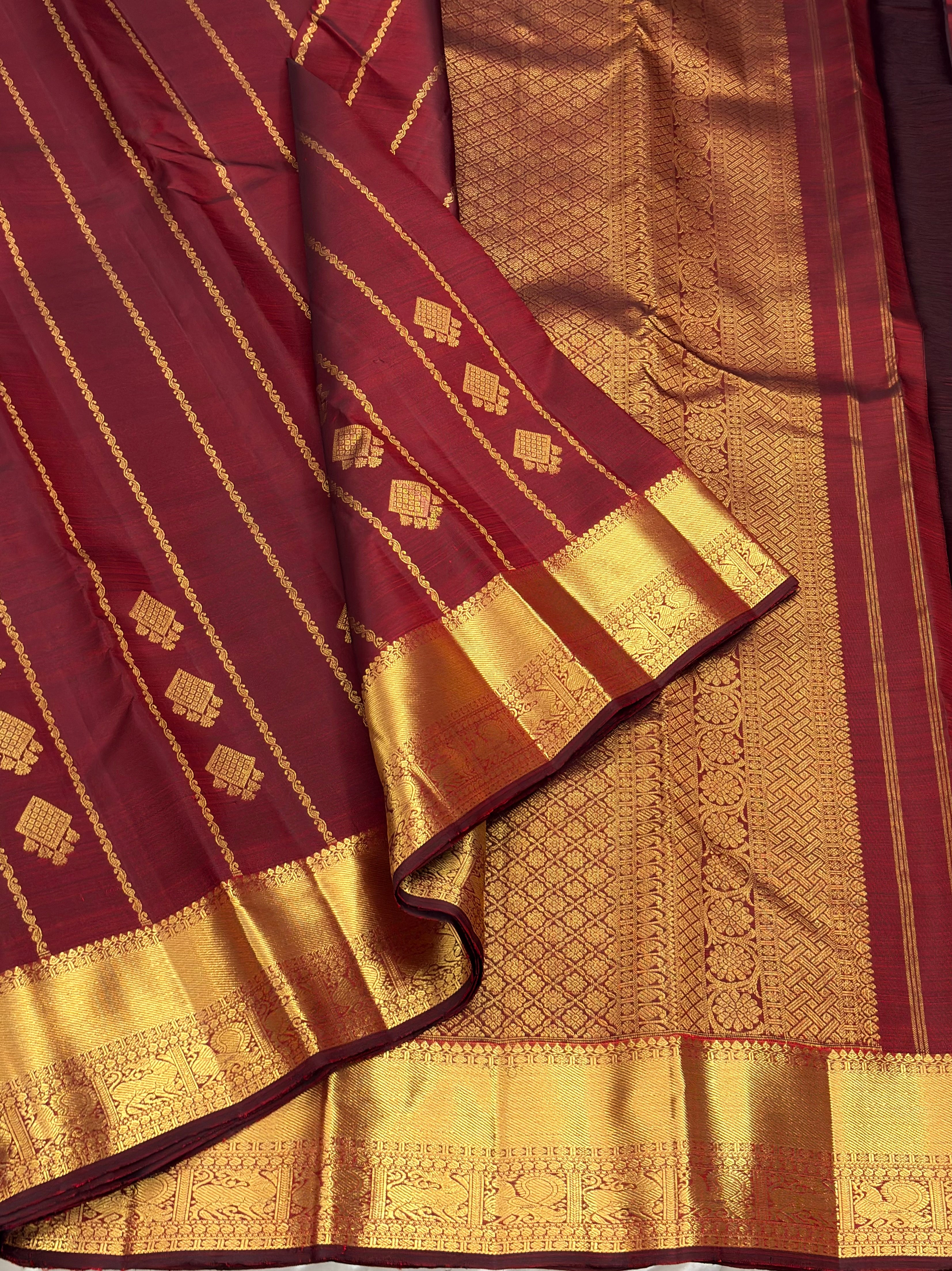 Maroon kanchipuram silk saree with veldhari weaving