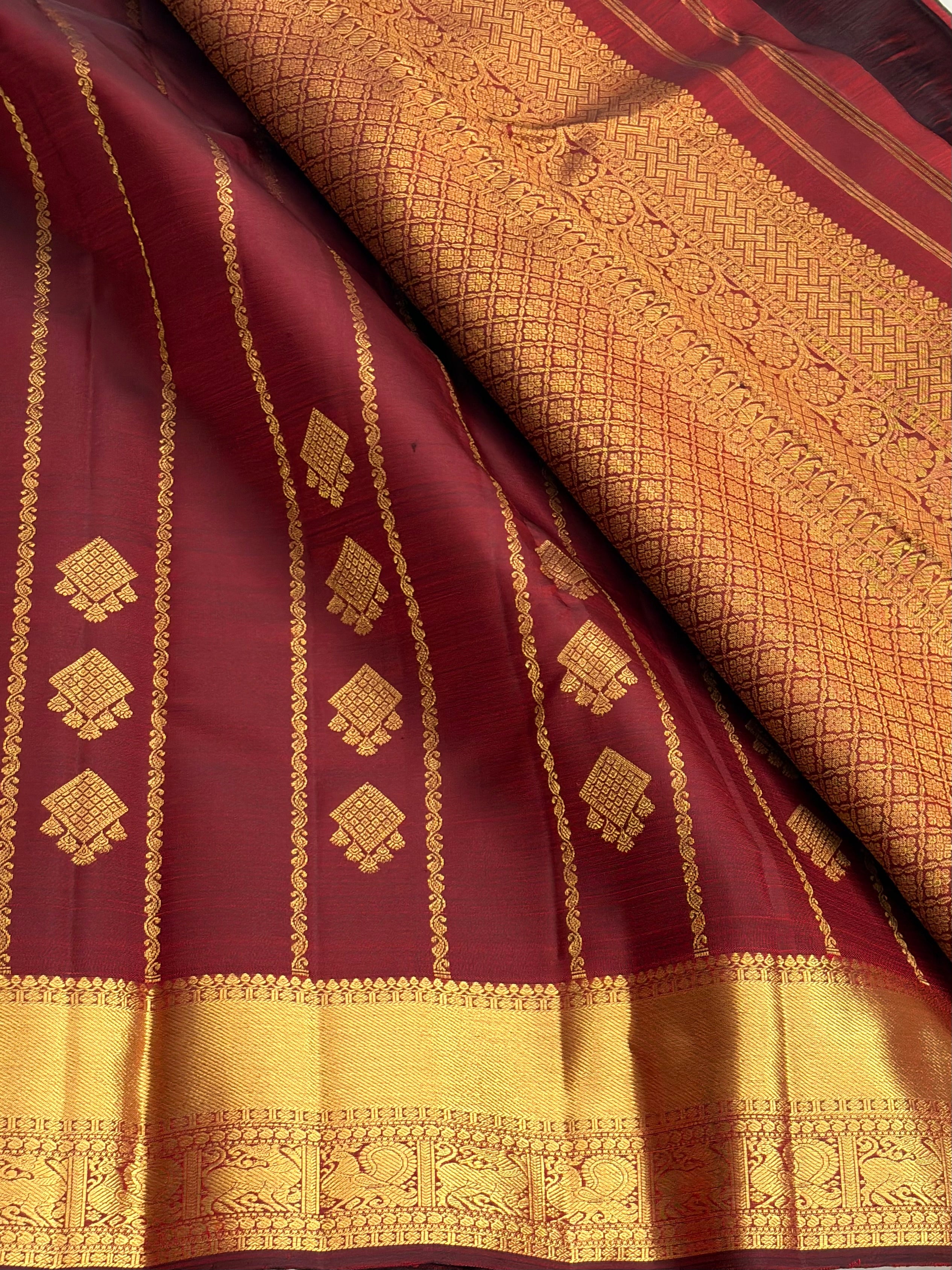 Maroon kanchipuram silk saree with veldhari weaving