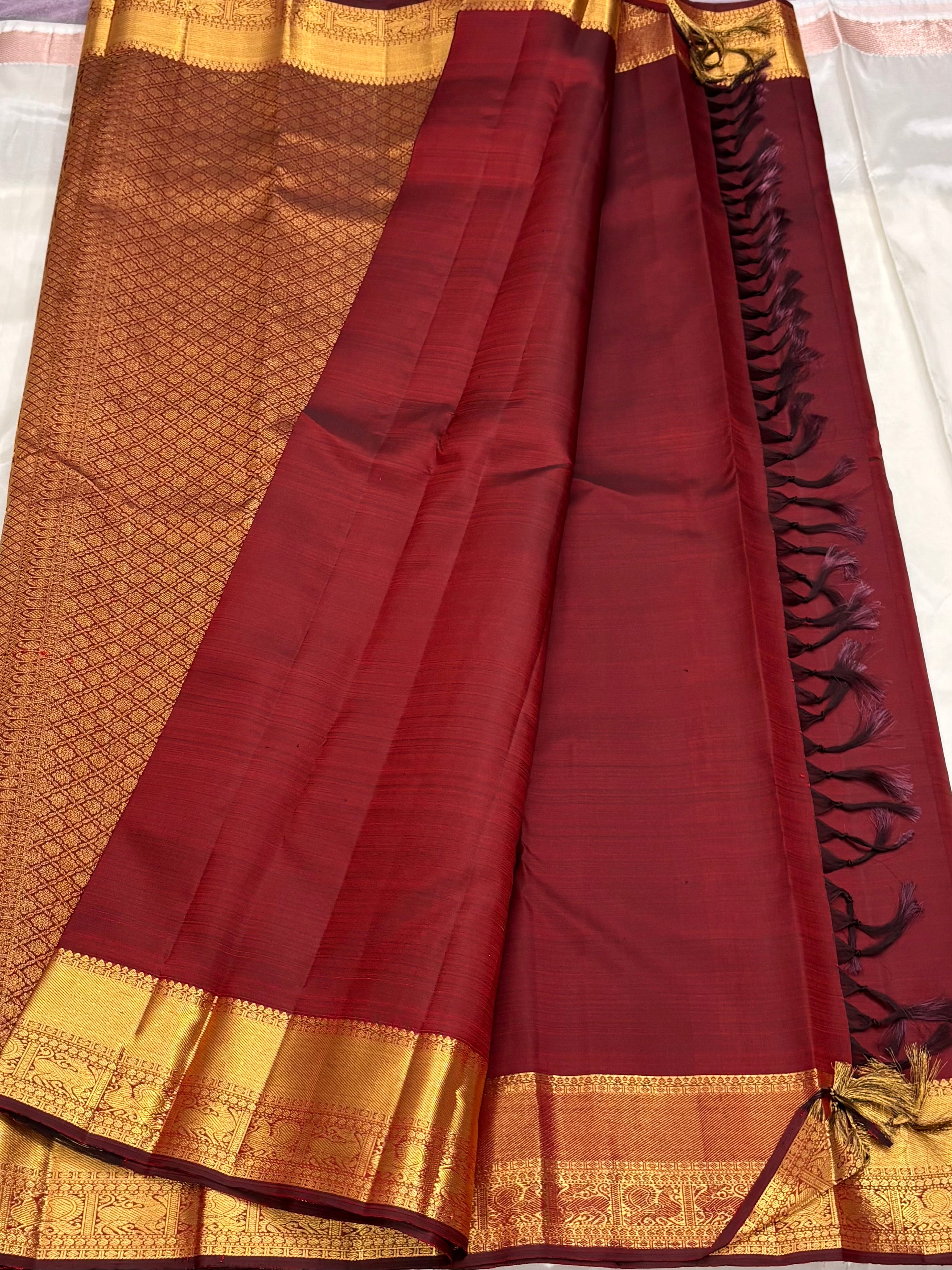Maroon kanchipuram silk saree with veldhari weaving