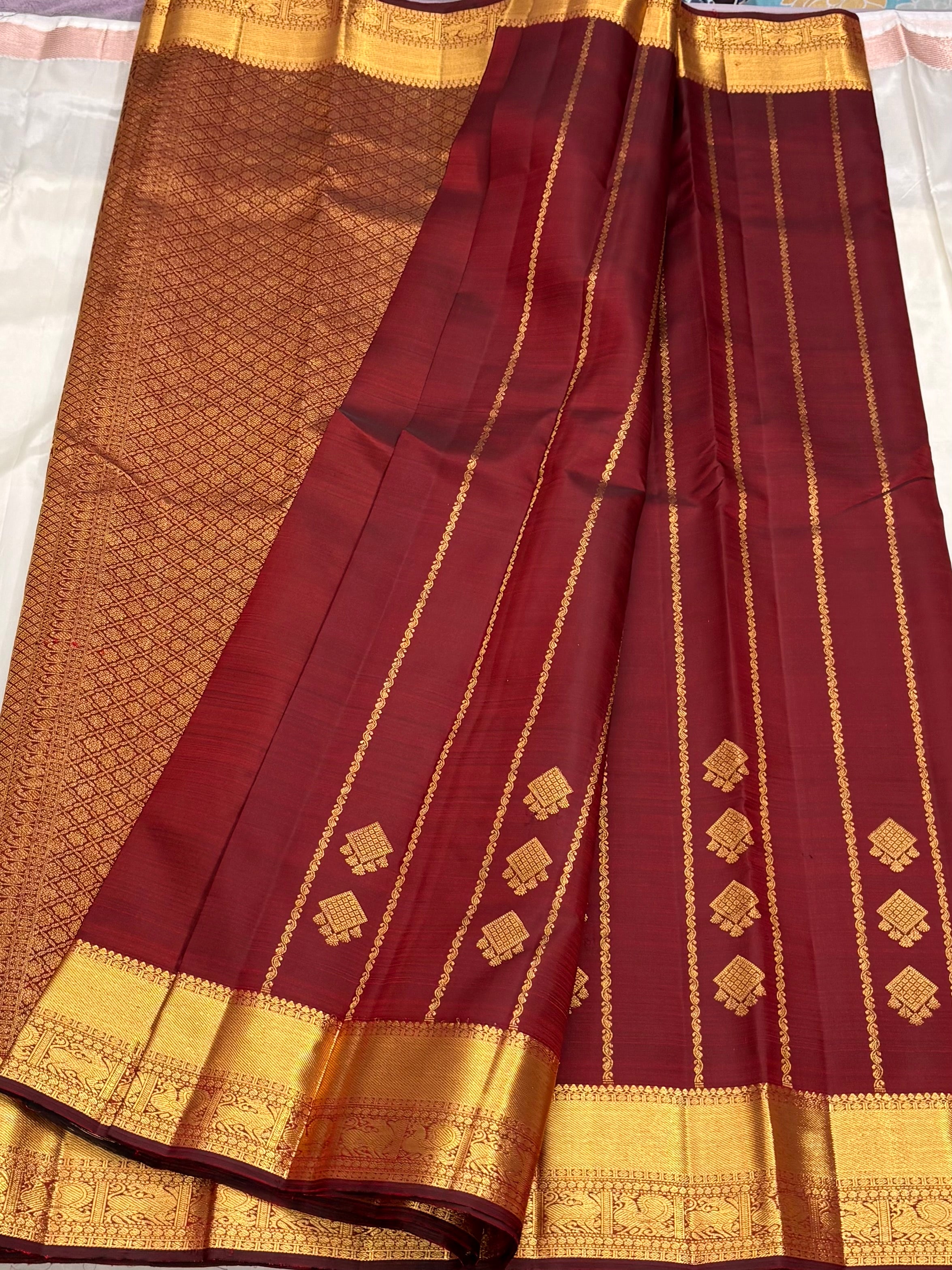 Maroon kanchipuram silk saree with veldhari weaving