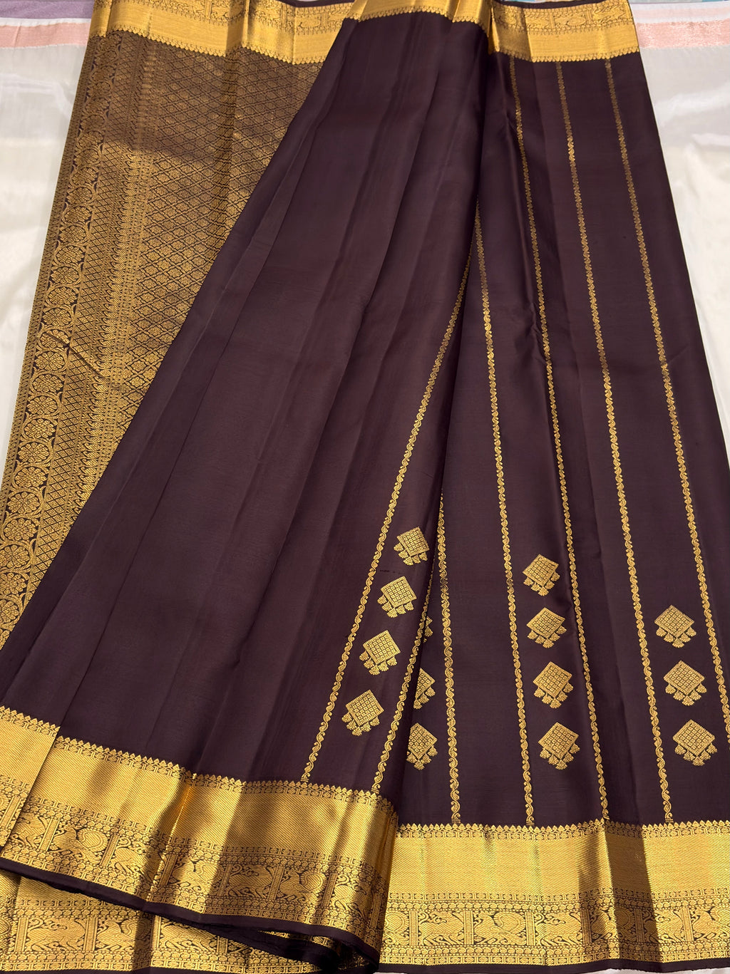 Brown Kancheevaram silk saree with vertical veldhari weaving